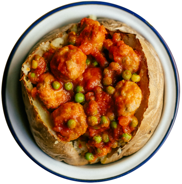 Meatballs with tomato and peas