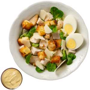 Poorcaesar salad (valerian, lettuce, chicken, hard-boiled egg, croutons, grana flakes) served with croutons