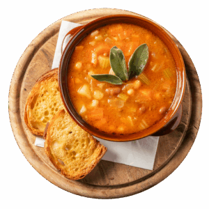 Zuppa di legumi servita con pane biscottato