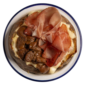 Porcini trifolati, fonduta di toma e speck