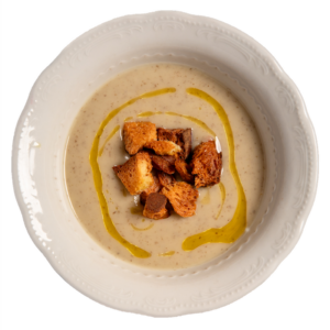 Vellutata di topinanbur e olio alla salvia servita con crostini